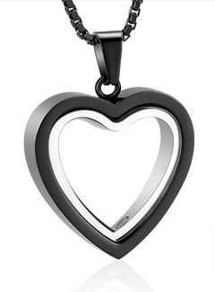 Stainless steel heart-shaped cremation pendant with engraved design, symbolizing remembrance and love.