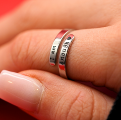 Silver "I Am Enough" ring featuring a simple band with engraved motivational message, designed for everyday wear.
