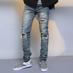 Men's ripped washed blue denim jeans with distressed detailing, showcasing casual style from My Store.
