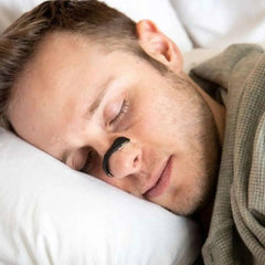 Magnetic nasal dilator strips for better sleep, showing clear adhesive strips with magnetic components to open nasal passages.