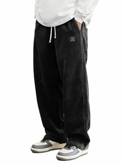 Men's relaxed-fit corduroy casual pants in a neutral color, featuring a comfortable waistband and classic corduroy texture.
