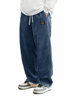 Men's relaxed-fit corduroy casual pants in earthy brown, showcasing the textured fabric and comfortable fit.