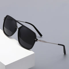 Classic men's dual-beam sunglasses with sleek frames, styled with a linen casual set, perfect for stylish outdoor wear.