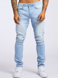 Slim-fit men's denim trousers from My Store, showcasing classic blue jeans with a modern fit and stylish stitching.