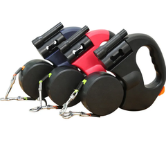 Auto double dog leash from My Store showing two adjustable nylon straps with metal clips for walking two dogs simultaneously.