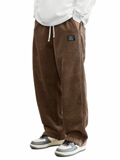 Men's relaxed-fit corduroy casual pants in tan, showing the textured fabric and classic fit style.
