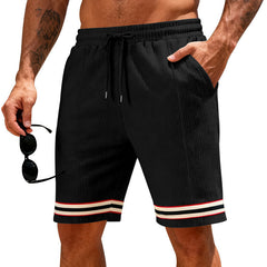 Men's breathable loose-fitting athletic shorts in lightweight fabric, shown in a neutral color for comfortable active wear.