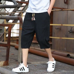 Men's casual loose linen cropped pants in light beige, featuring a relaxed fit and comfortable waistband.