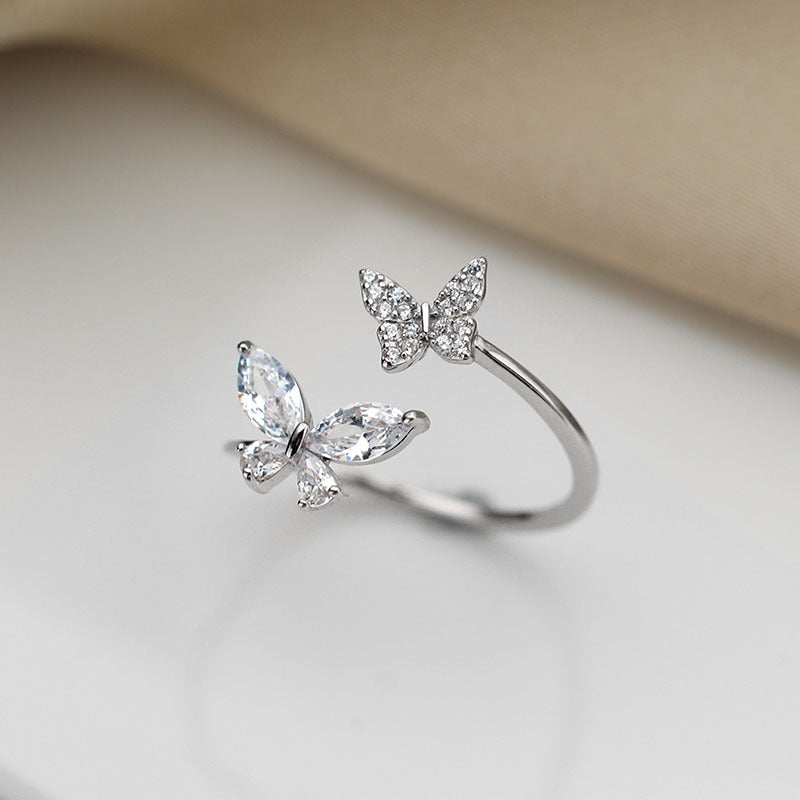 Sterling silver butterfly ring for women featuring intricate butterfly design and polished finish, showcasing elegant jewelry craftsmanship.
