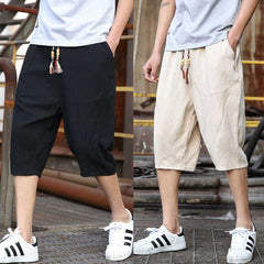 Men's casual loose linen cropped pants in neutral color, featuring relaxed fit and lightweight fabric for comfortable style.
