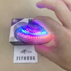 Flynova Mini UFO spinner by My Store spinning above a hand, showcasing its compact design and colorful LED lights.
