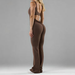 Flared jumpsuit from My Store featuring a fitted bodice, wide-leg pants, and stylish design, perfect for casual or dressy occasions.
