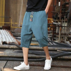 Men's casual loose linen cropped pants in light, breathable fabric, featuring a relaxed fit and adjustable waistband.