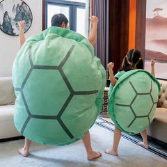 Green wearable turtle shell pillow designed for comfort and support, featuring a soft, plush texture and turtle shell pattern.