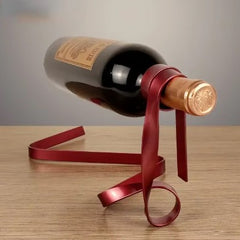 Ribbon wine rack by My Store with a sleek, curved metal design holding multiple wine bottles in a modern display.