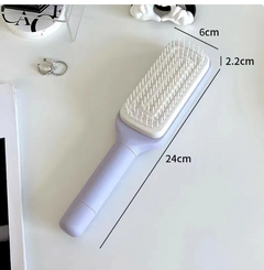 4-in-1 self-cleaning brush from My Store featuring a ergonomic handle and multiple brush heads for versatile cleaning.