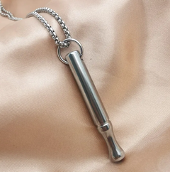 Silver breathing necklace for anxiety relief, featuring a pendant with engraved calming breath pattern, designed for stress reduction.