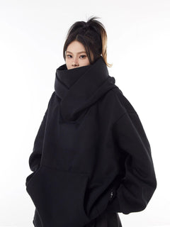 Fleece-lined loose high collar hoodie in soft fabric, featuring a relaxed fit and high neckline for cozy comfort.