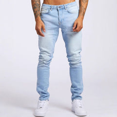 Slim-fit men's denim trousers by My Store, showcasing classic blue jeans with a modern fit and stitching details.