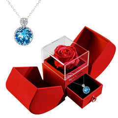 Christmas jewelry box necklace from My Store, open to reveal a festive pendant inside on a velvet interior.