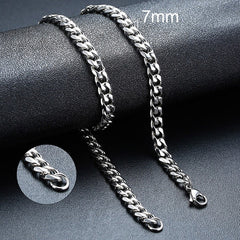 Twisted Rope Figaro Necklace in silver with bold, layered chain links, showcasing intricate chain design and shiny finish.