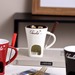 Rustic ceramic fondue mug set for cheese or chocolate, with handles and dipping forks, perfect for communal dessert or snack sharing.