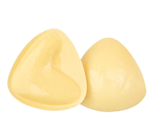 Adhesive V-shape bra inserts for lift and shaping, designed to enhance cleavage and support for seamless under clothing.