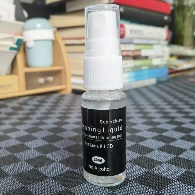 Crystal Clear Lens Cleaner bottle from My Store, with cleaning solution and spray nozzle for glasses and camera lenses.