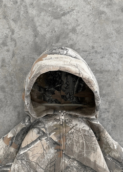 Urban camo retro hoodie with a bold camouflage pattern and relaxed fit, featuring a drawstring hood and ribbed cuffs.