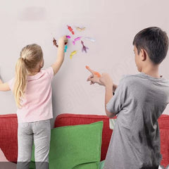 Colorful Dino-Launch slingshot finger toy with dinosaur design and elastic band for fun outdoor play.