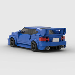 Red Subaru WRX STI sports car parked outdoors, showcasing sleek design and aggressive front grille.