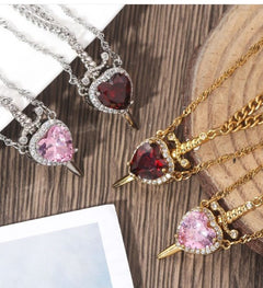 Silver Love Dagger Necklace by My Store featuring a detailed dagger pendant on a delicate chain.