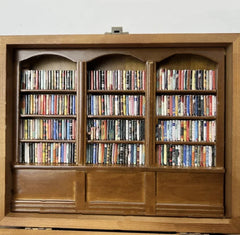 Anxiety bookshelf titled "Shake Away Your Anxiety" with colorful books and calming decor, designed to reduce stress and promote relaxation.