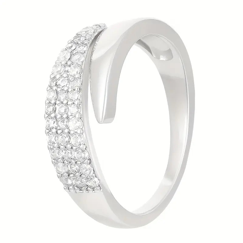 Elegant adjustable sparkle ring with shimmering stones, showcasing a stylish silver band and intricate design.