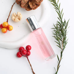 Pheromone perfume for women in a sleek bottle, designed to enhance attraction and confidence.