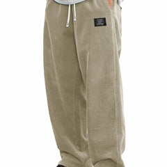 Men's relaxed-fit corduroy casual pants from My Store, showing beige textured fabric and tapered leg fit.