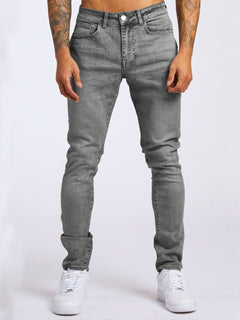 Slim-fit men's denim jeans from My Store, showcasing classic blue jeans with front pockets and a modern slim silhouette.