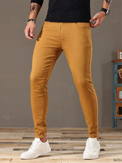 Men's denim stretch bike-style pants showing a fitted design with belt loops and classic denim texture.