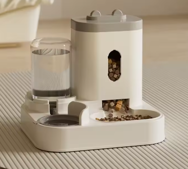 Automatic pet feeder with water dispenser for dogs and cats, featuring a basin and bowl for easy feeding and hydration.
