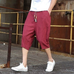 Mens casual loose linen cropped pants in beige, featuring a relaxed fit and lightweight fabric for comfortable everyday wear.