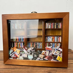 Anxiety bookshelf titled "Shake Away Your Anxiety" with colorful books and calming decor, designed to reduce stress and promote relaxation.
