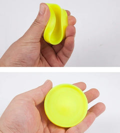 Mini flying disc catching game in bright colors, featuring two small discs and catching net for outdoor fun.