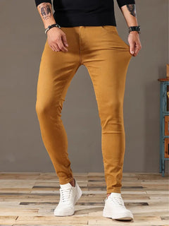 Men's denim stretch bike-style pants with a fitted design, featuring classic denim texture and casual style.