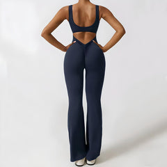 Flared jumpsuit from My Store featuring a fitted bodice and wide-leg pants, made from lightweight fabric, displayed on a hanger.