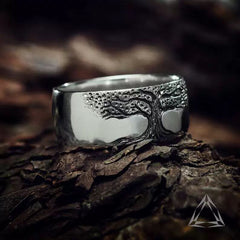 Simple retro carved Tree of Life ring with intricate design in silver-tone metal, showcasing a detailed nature-inspired pattern.