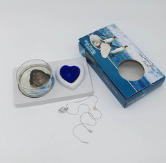 Freshwater pearl necklace inside a elegant jewelry gift box, showcasing white pearls and a satin-lined interior.