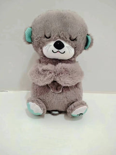 Portable plush baby toy otter with sensory details, music, lights, and rhythmic breathing motion for soothing comfort.