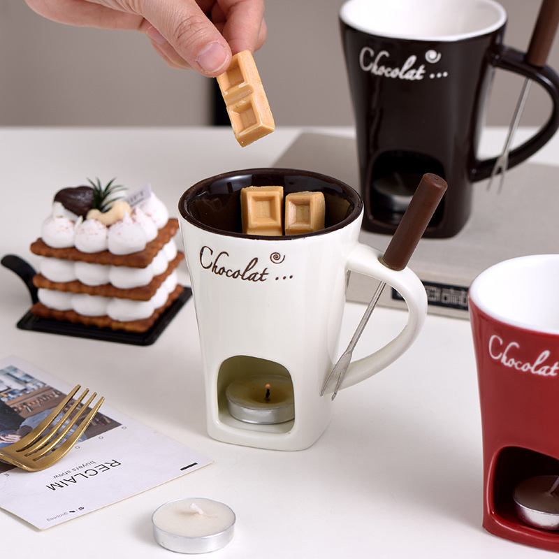 Decorative fondue mug set from My Store with small mugs and a matching stand, perfect for serving dipping sauces or chocolate.