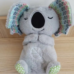 Soft plush otter baby toy from Sound Machine Soothe 'n Snuggle with sensory features, music, lights, and rhythmic breathing motion.