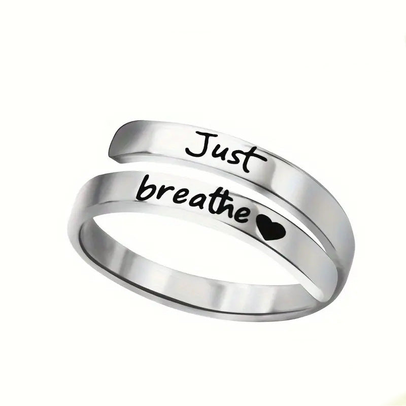 Silver spiral heart ring featuring a delicate design, perfect for adding a stylish touch to any jewelry collection.